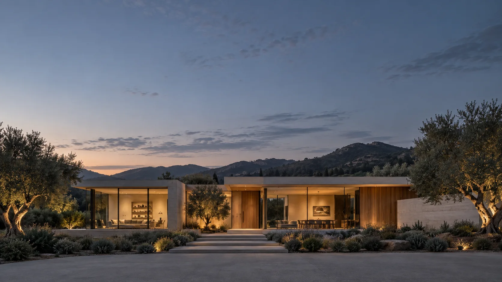 A warmly lit modern home beneath an open evening sky